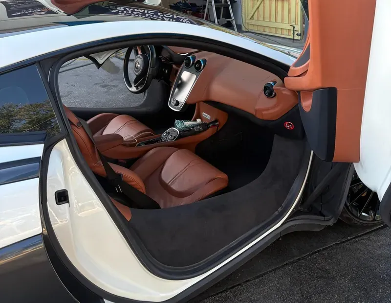 McLaren interior with open scissor door after detailing
